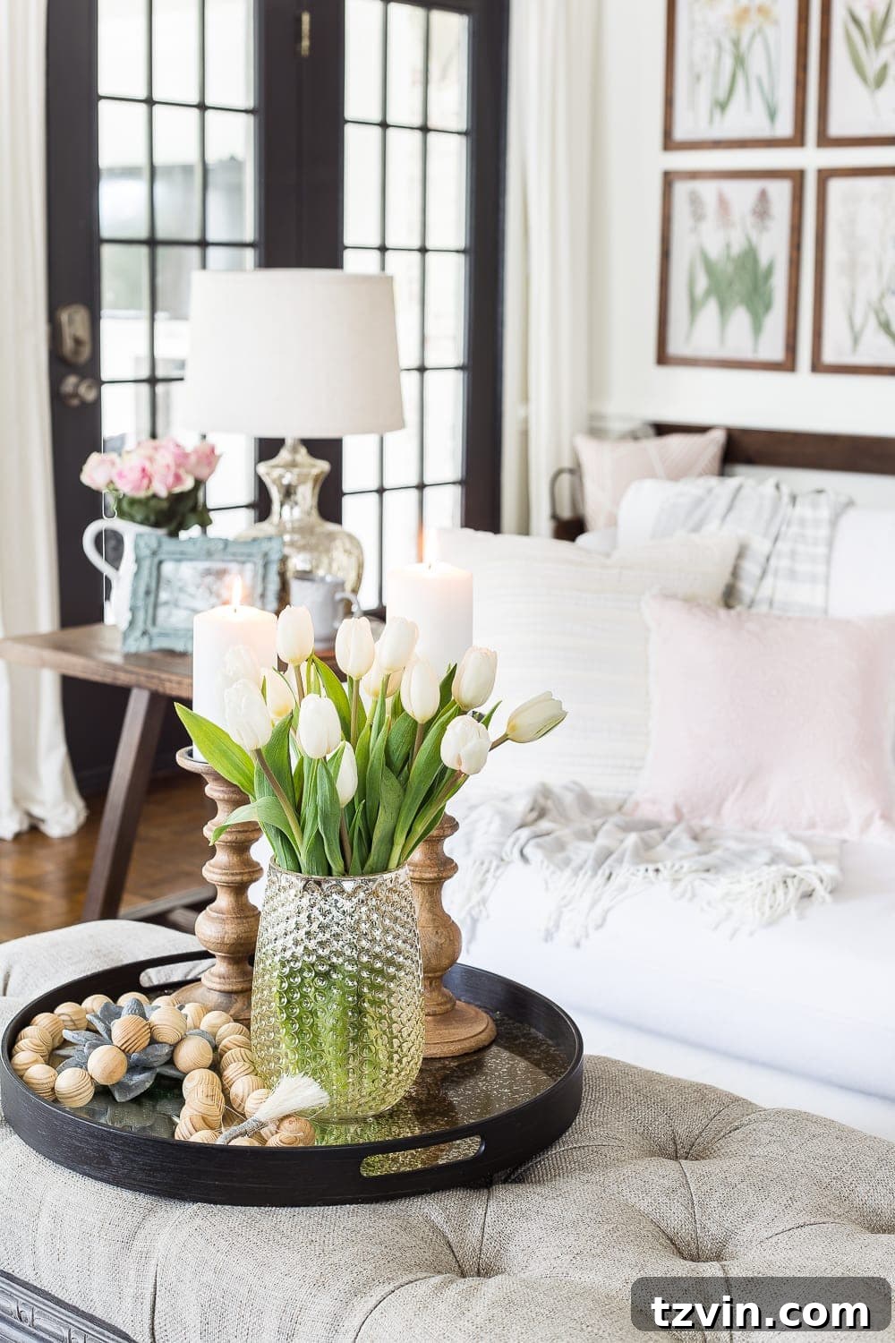 Spring Refresh Living Room Reveal 9 A light-filled living room featuring neutral tones, natural wood elements, and fresh spring flowers, ideal for 'minimalist spring decor' and 'home staging inspiration'.