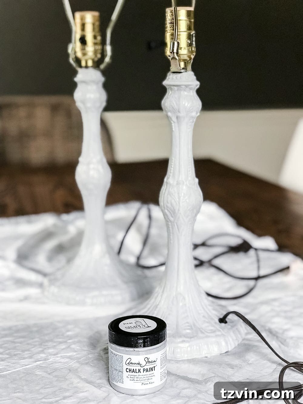 Olivia's Bedroom Transformation: A Baroque Lamp Revival 4 Applying the first coat of Annie Sloan Chalk Paint in Paris Grey to a thrifted Baroque lamp as part of a DIY makeover for a girl's bedroom.