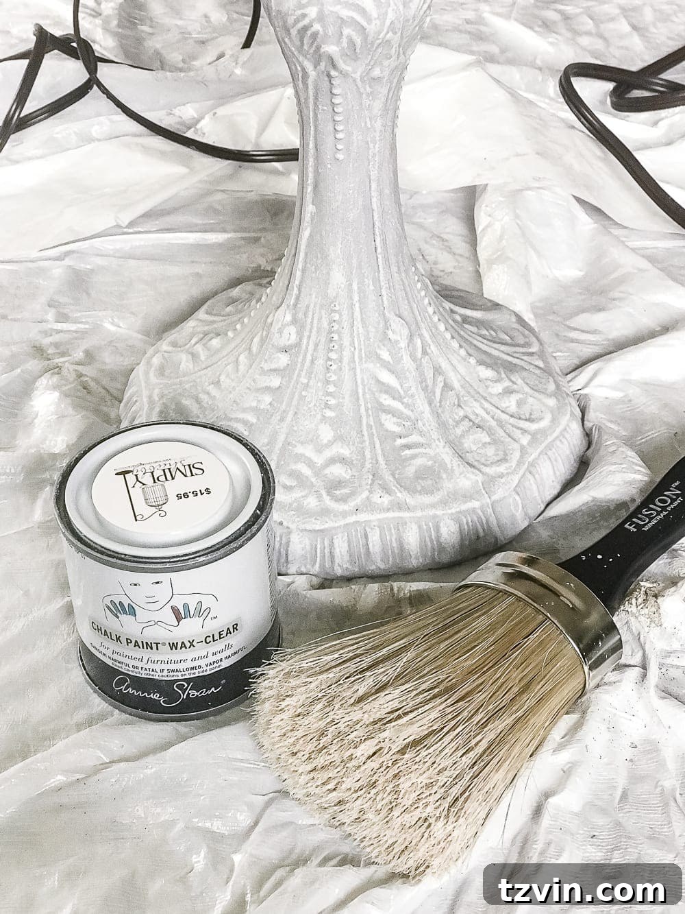 Olivia's Bedroom Transformation: A Baroque Lamp Revival 7 Applying Annie Sloan Clear Wax to a newly painted Baroque lamp, demonstrating the sealing and protecting step in the DIY lamp makeover.