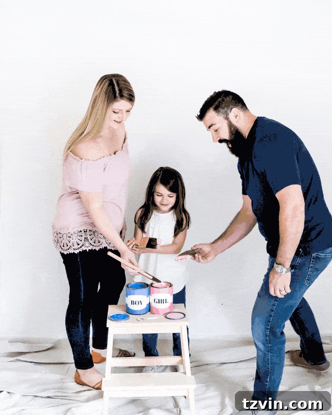 Our Budding Baby Reveal 5 Animated GIF showing vibrant pink paint being splattered onto a white wall, revealing the baby's gender.
