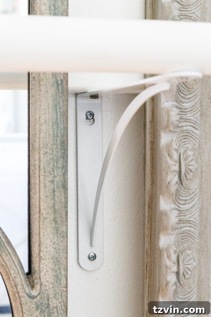 Crafting a Ballet Barre and Mastering Chair Rail Decor 6 Ballet barre shelf brackets installed with the wooden dowel rod. Showing a finished ballet barre section in a girl's room. #KidsDecorIdeas #BalletRoom #DIYProject #FunctionalDesign