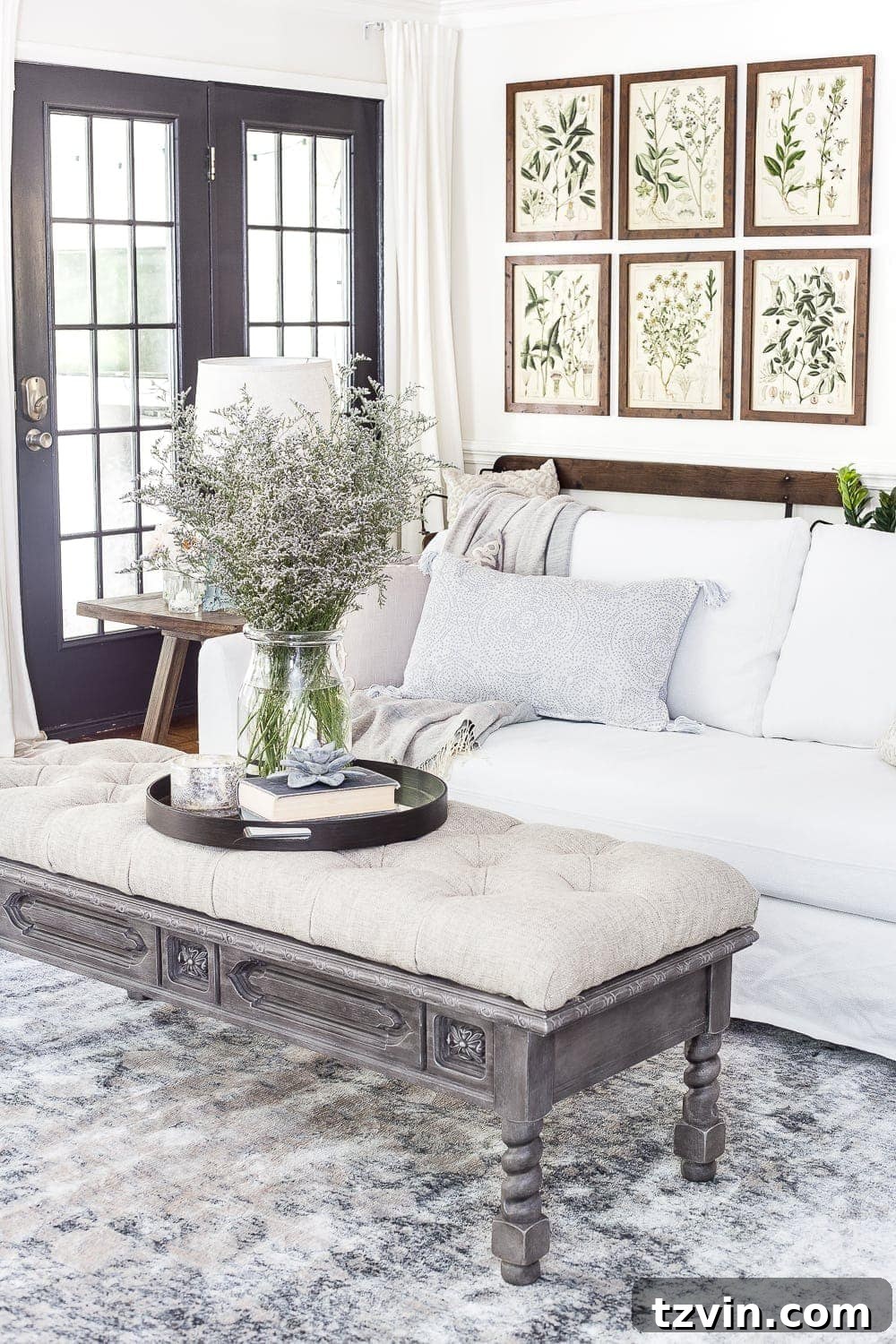 summer living room featuring summer botanical prints and blue/gray accents