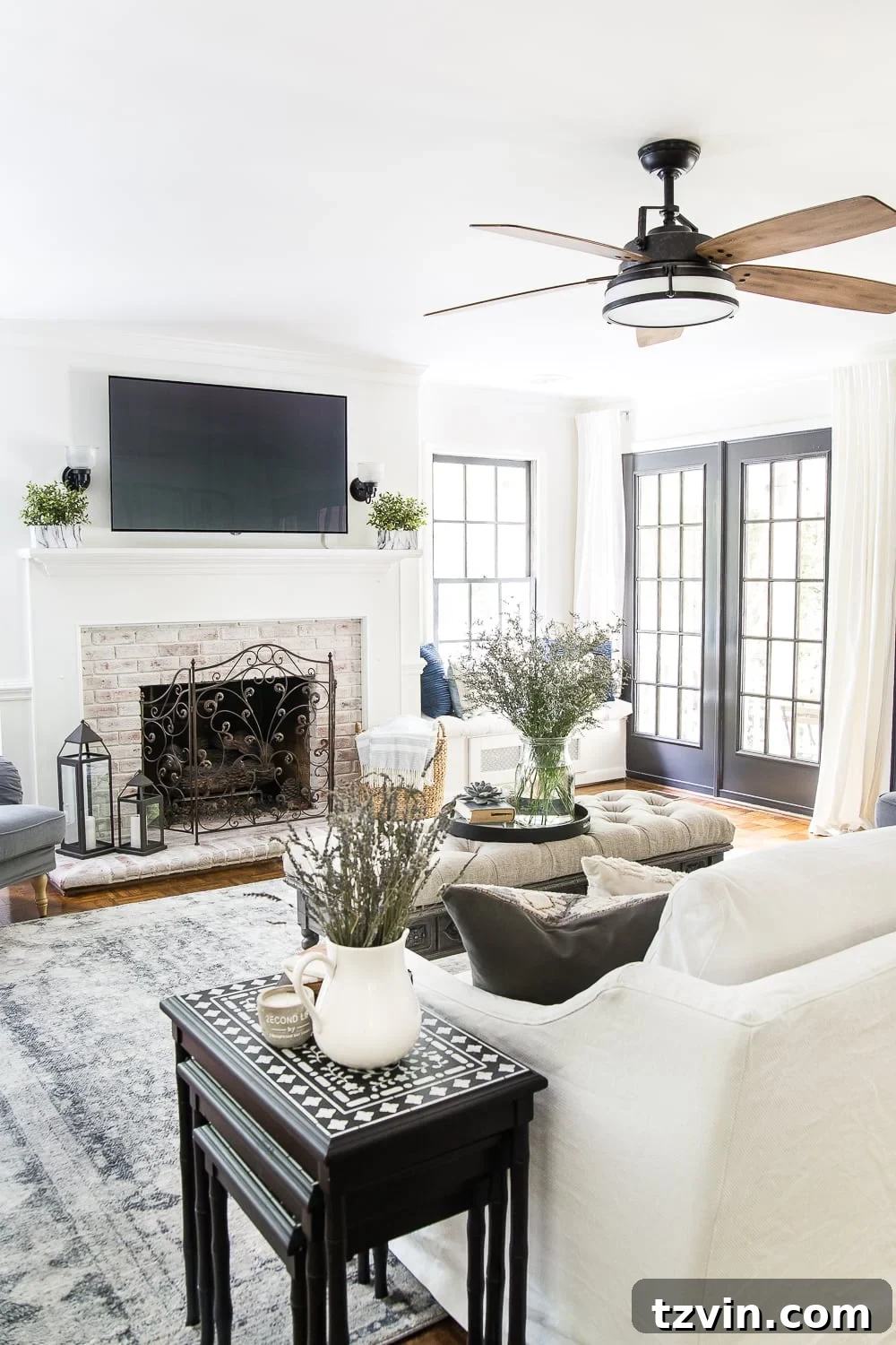 summer living room with limewashed brick fireplace