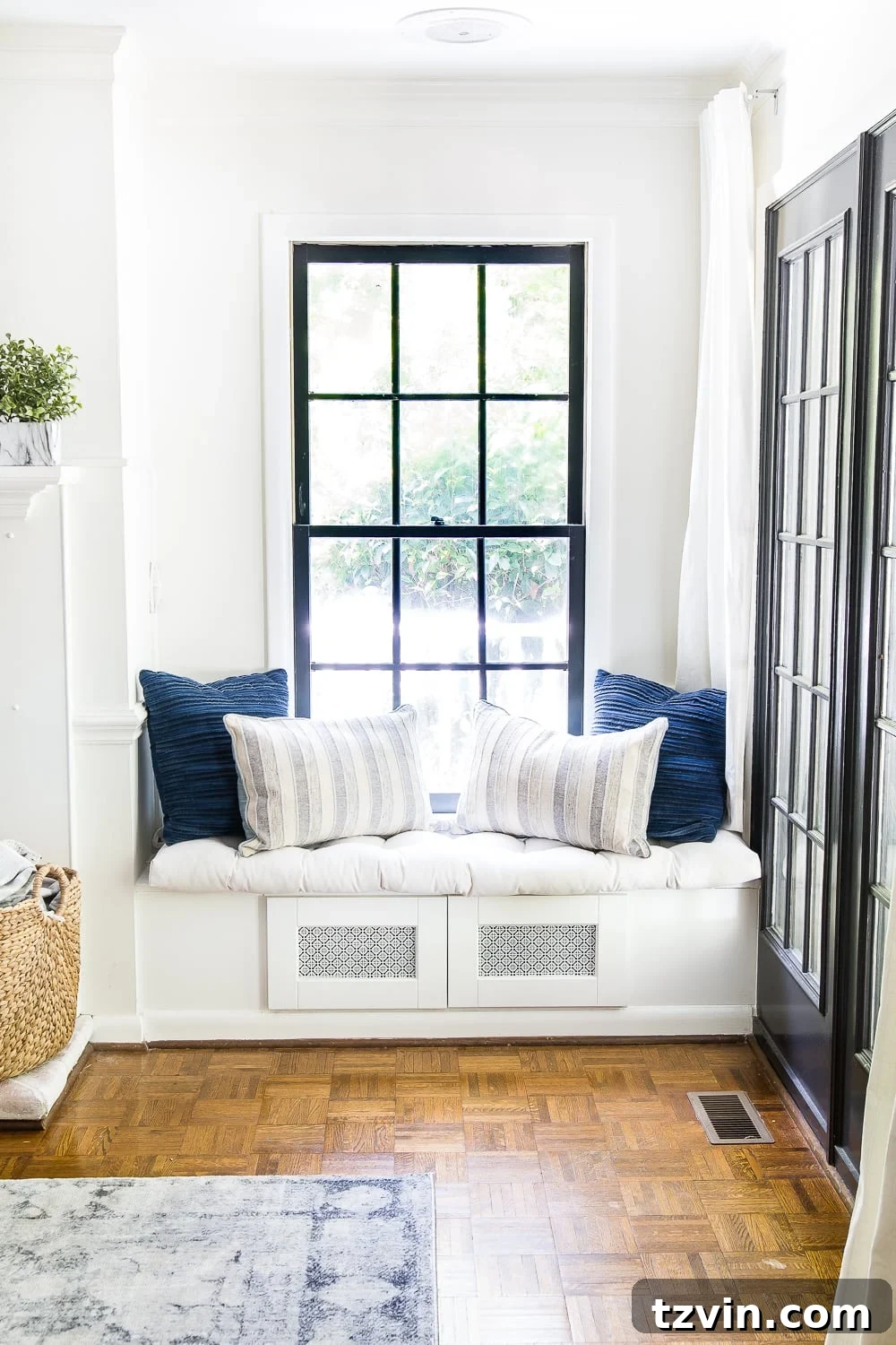 DIY window seat made from a kitchen cabinet to hide TV cable boxes and gaming system