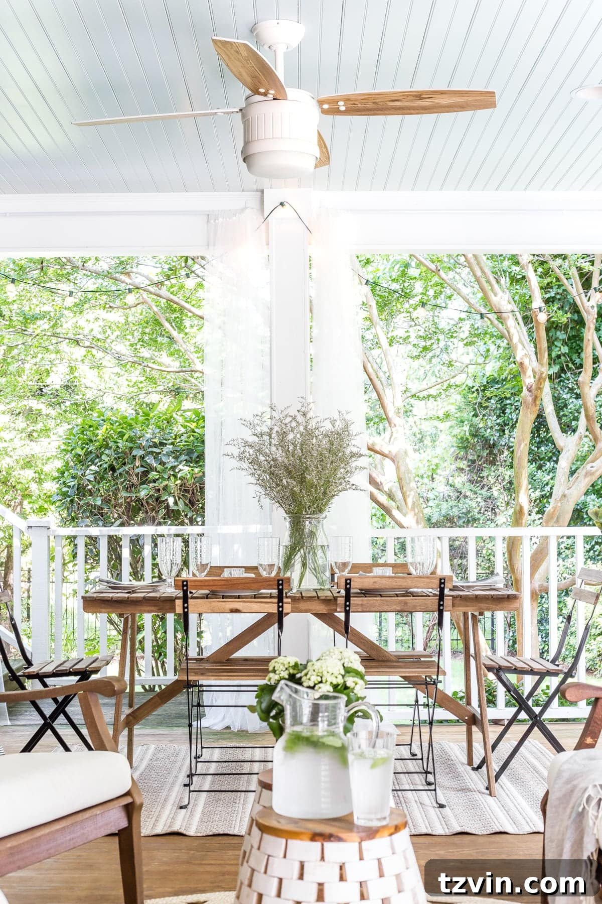 An inviting summer outdoor dining table set on the back porch, perfect for meals with family and friends.