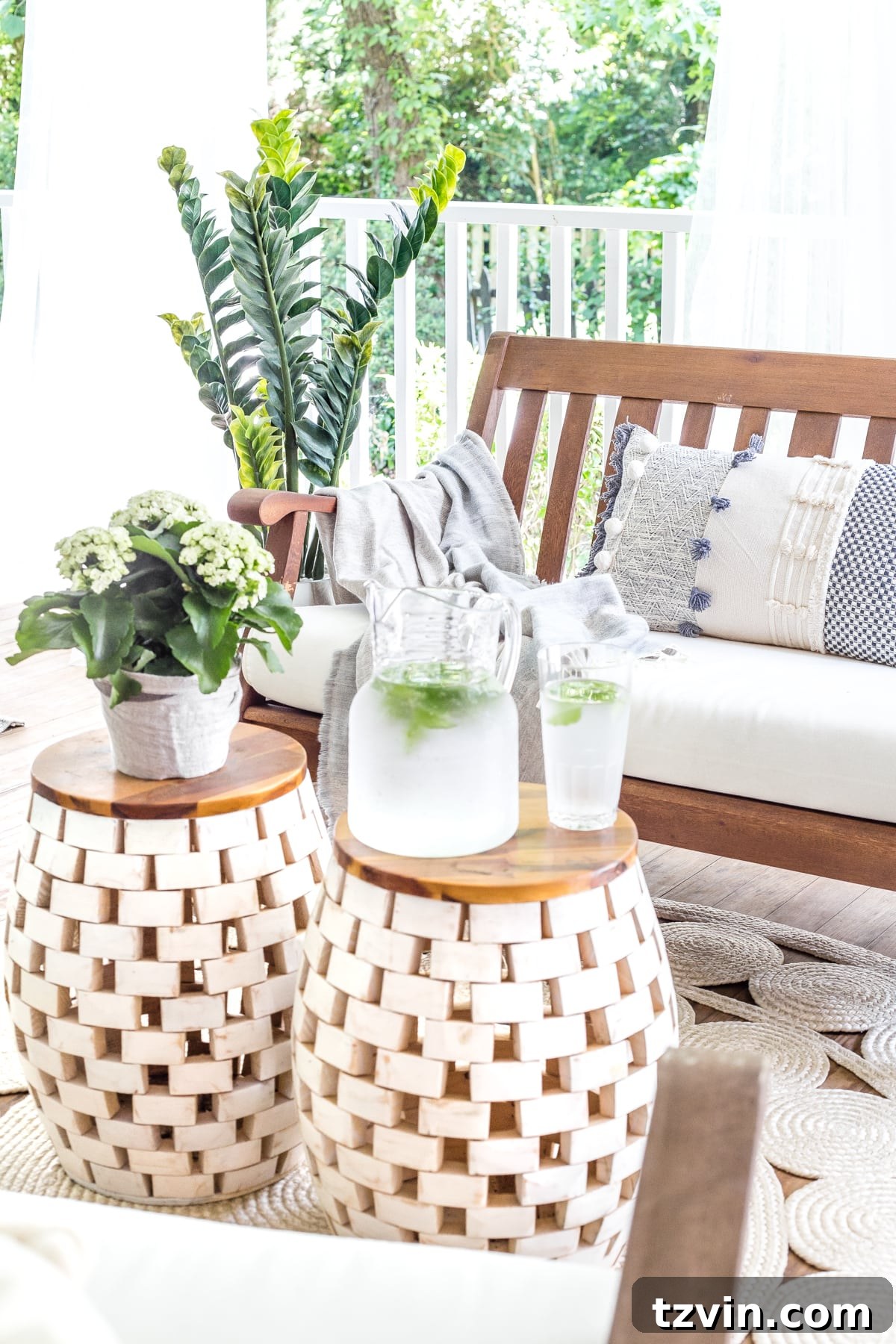 Summer decor on the back porch with versatile garden stools and a comfortable outdoor bench, perfect for morning coffee.