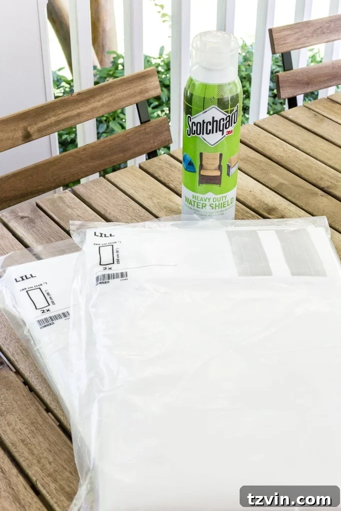 Sub-$100 Porch Paradise: DIY Curtains & Screens 3 Close-up of a DIY outdoor curtain made from IKEA Lill mosquito net, treated with Scotchgard for weather-proofing, adding a stylish and functional element to the porch.
