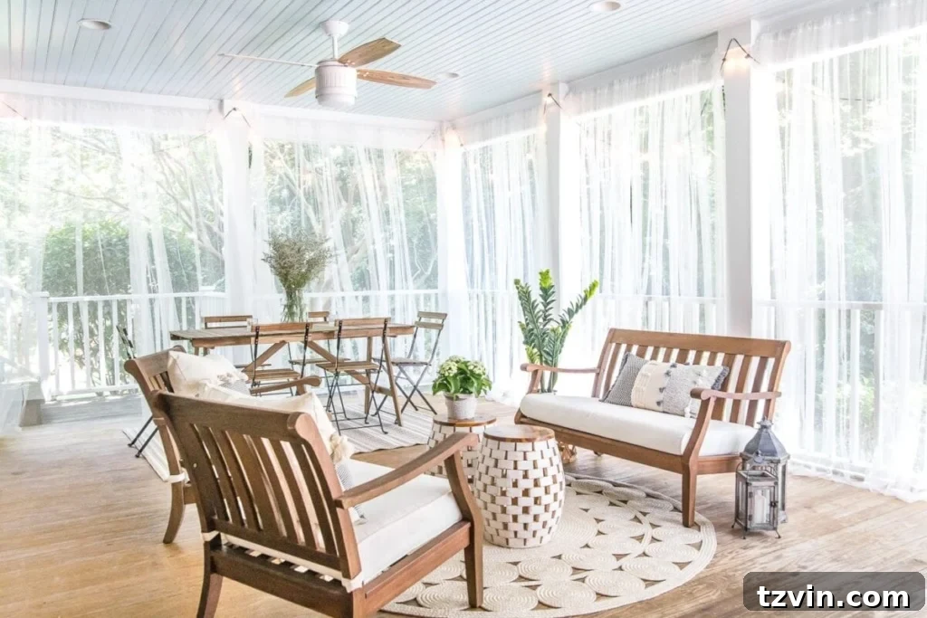 Sub-$100 Porch Paradise: DIY Curtains & Screens 7 Beautiful screened porch featuring DIY outdoor curtains, offering a chic and functional barrier against insects while preserving an open feel.