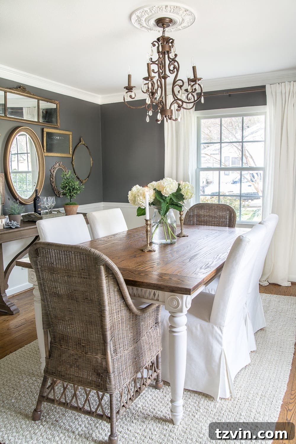 Dark charcoal dining room with woods and whites, ready for French sconces