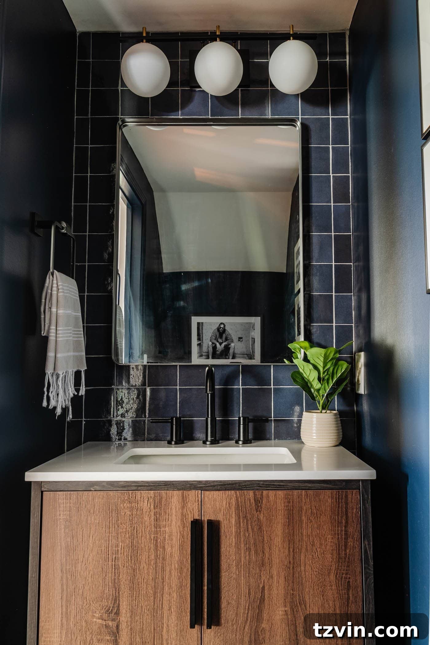 23 Smart Hacks to Make Your Small Room Feel Instantly Bigger 5 small bathroom ideas with navy blue walls and glossy blue tiles