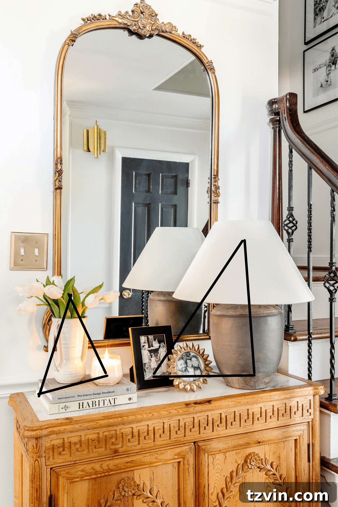 23 Smart Hacks to Make Your Small Room Feel Instantly Bigger 10 small entryway with gold mirror, concrete lamp, and storage chest