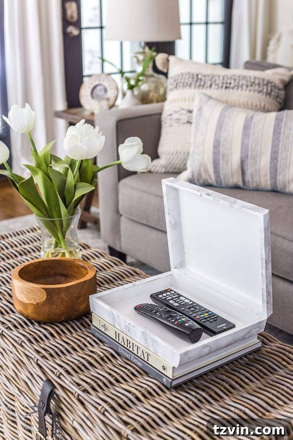 30 Must-Have Home Decor Treasures from Thrift Stores 49 A transformed remote control holder, made from a thrifted cigar box, styled on a coffee table.