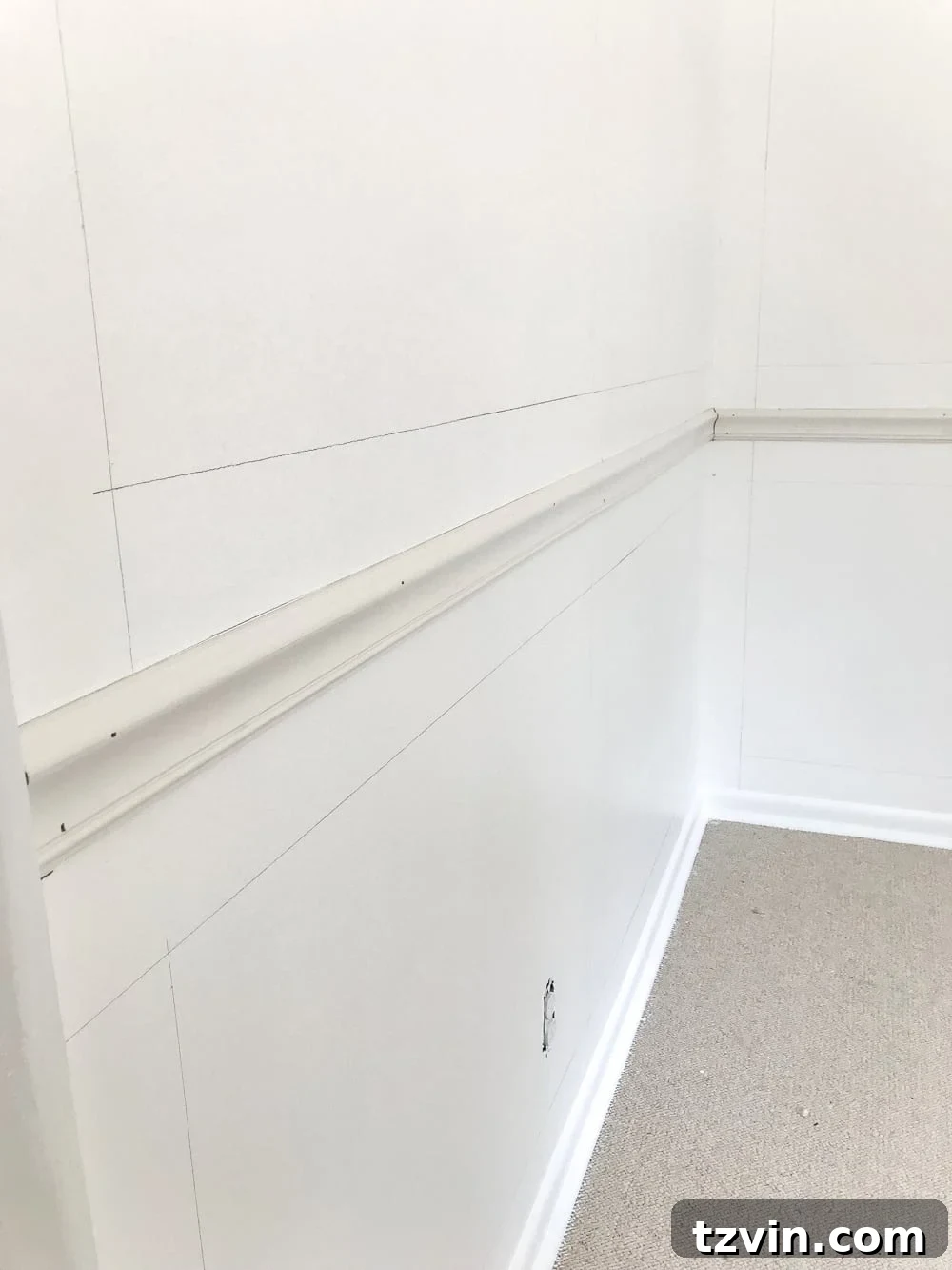 Frame Your Art: DIY Molding Mastery 5 mark walls for picture frame molding using a 4" board as a spacer