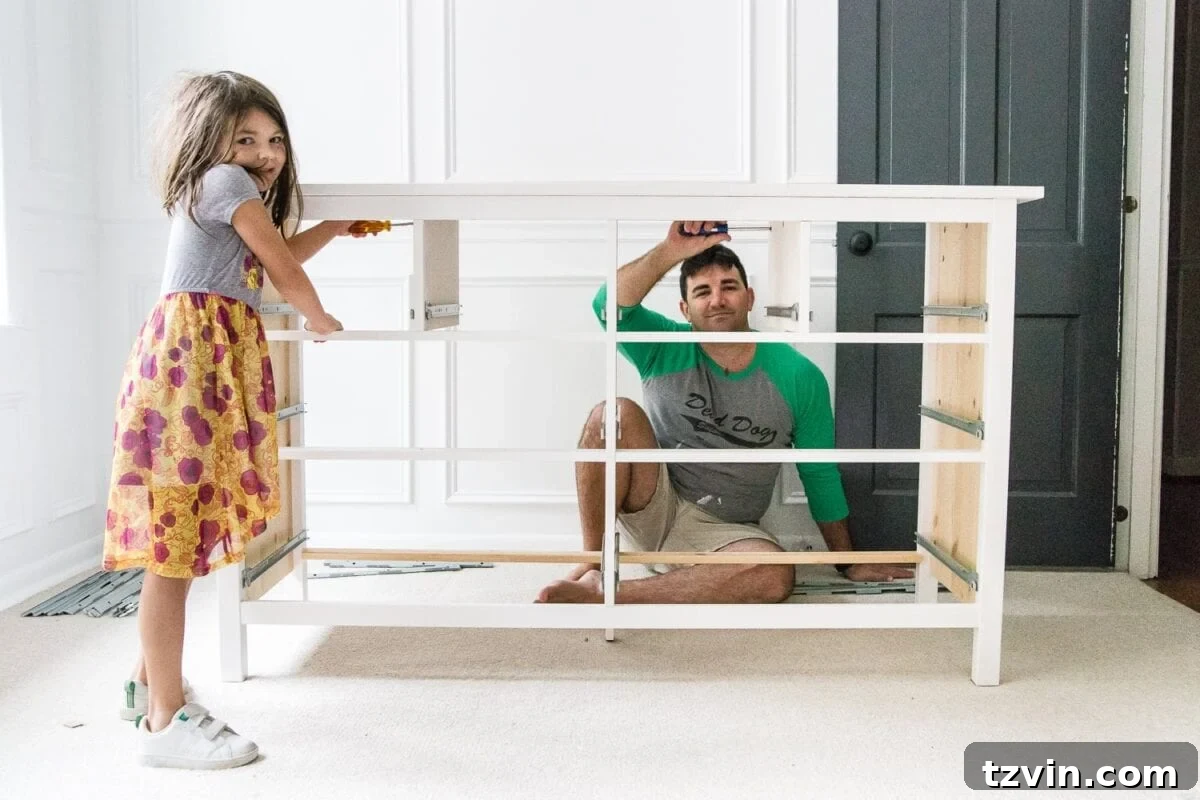 Elevated IKEA Hemnes Dresser Makeover 4 Father and daughter building an IKEA Hemnes dresser together for a nursery