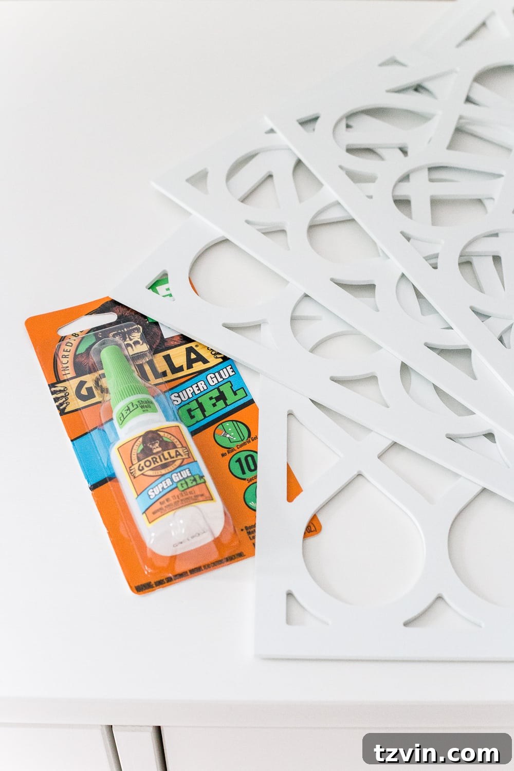 Elevated IKEA Hemnes Dresser Makeover 8 Applying Gorilla Super Glue Gel to O'verlays appliques for secure attachment to an IKEA dresser drawer