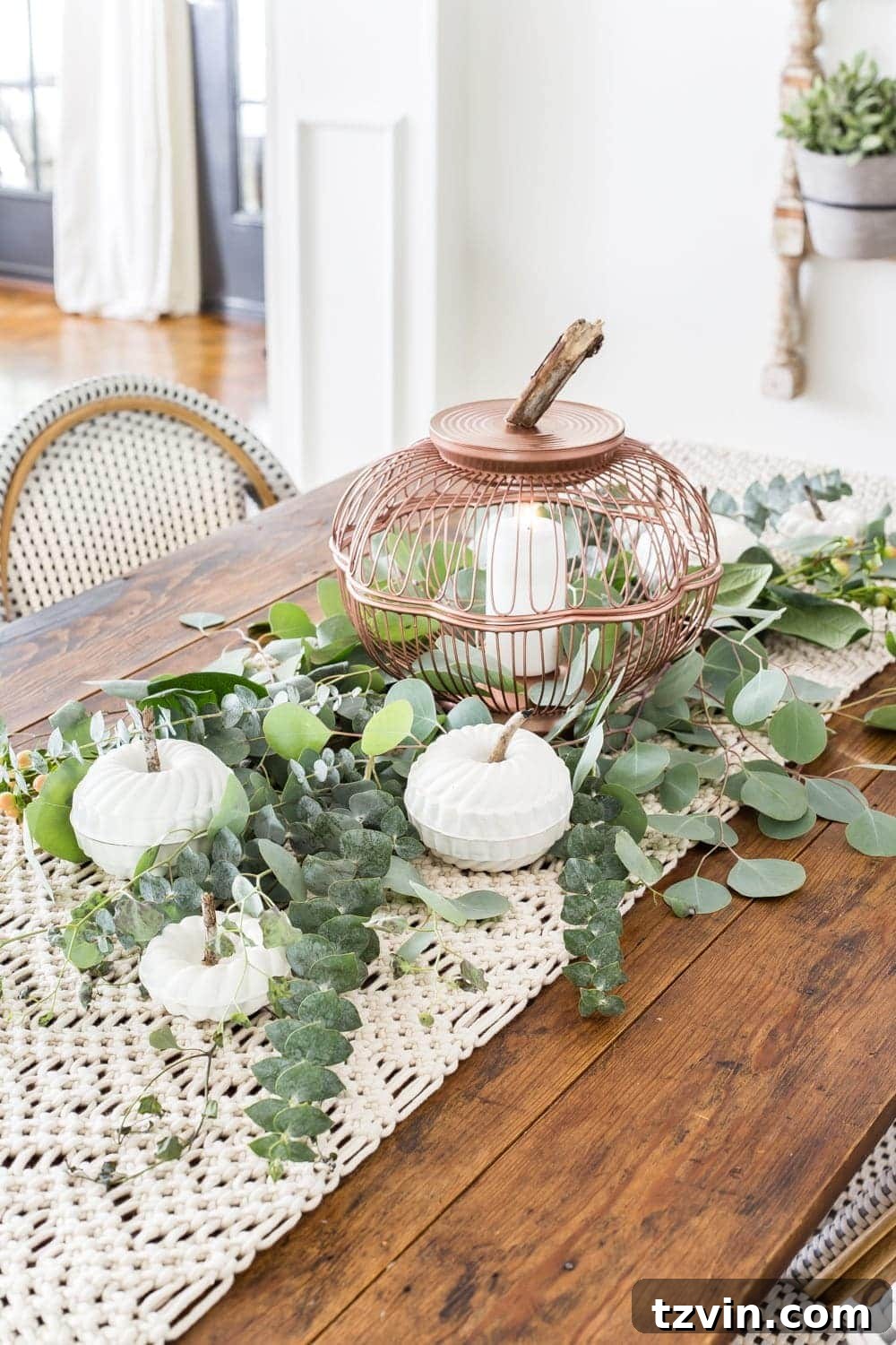 Fall centerpiece with DIY pumpkin lantern using thrifted wire bread baskets and craft pumpkins using mini bundt pan Jello molds