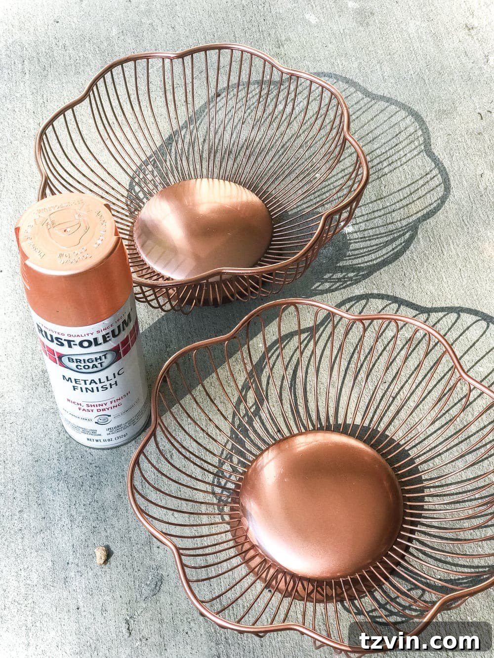 copper spray painted wire bread baskets to make a pumpkin