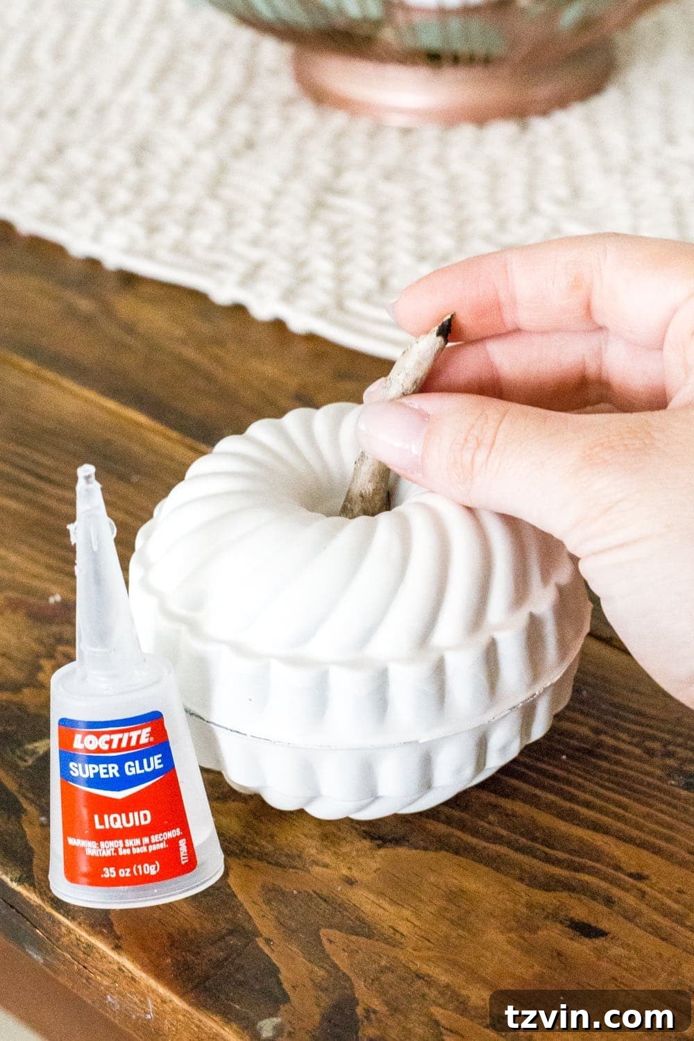 glue two mini bundt pan Jello molds together and stick a twig in the top to make a DIY mini pumpkin
