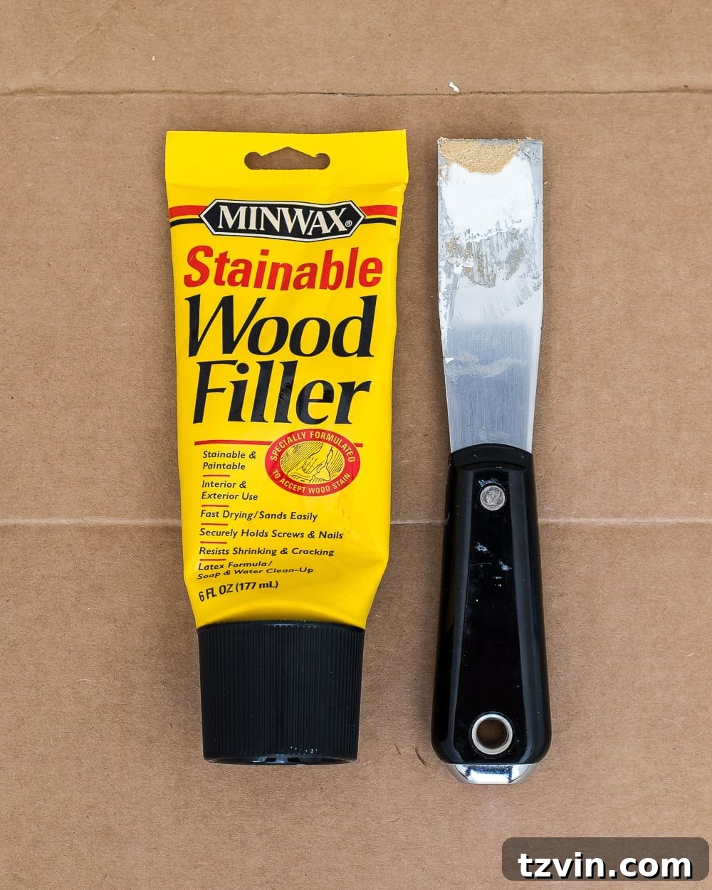 wood filler applied and sanded before painting interior doors for a smooth finish
