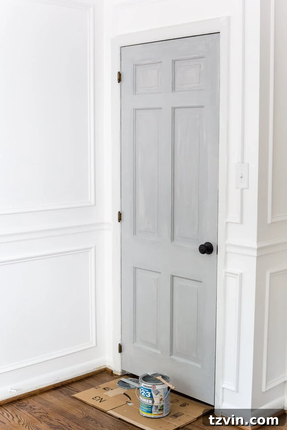 painting a door with tinted primer ensures a consistent base for the topcoat