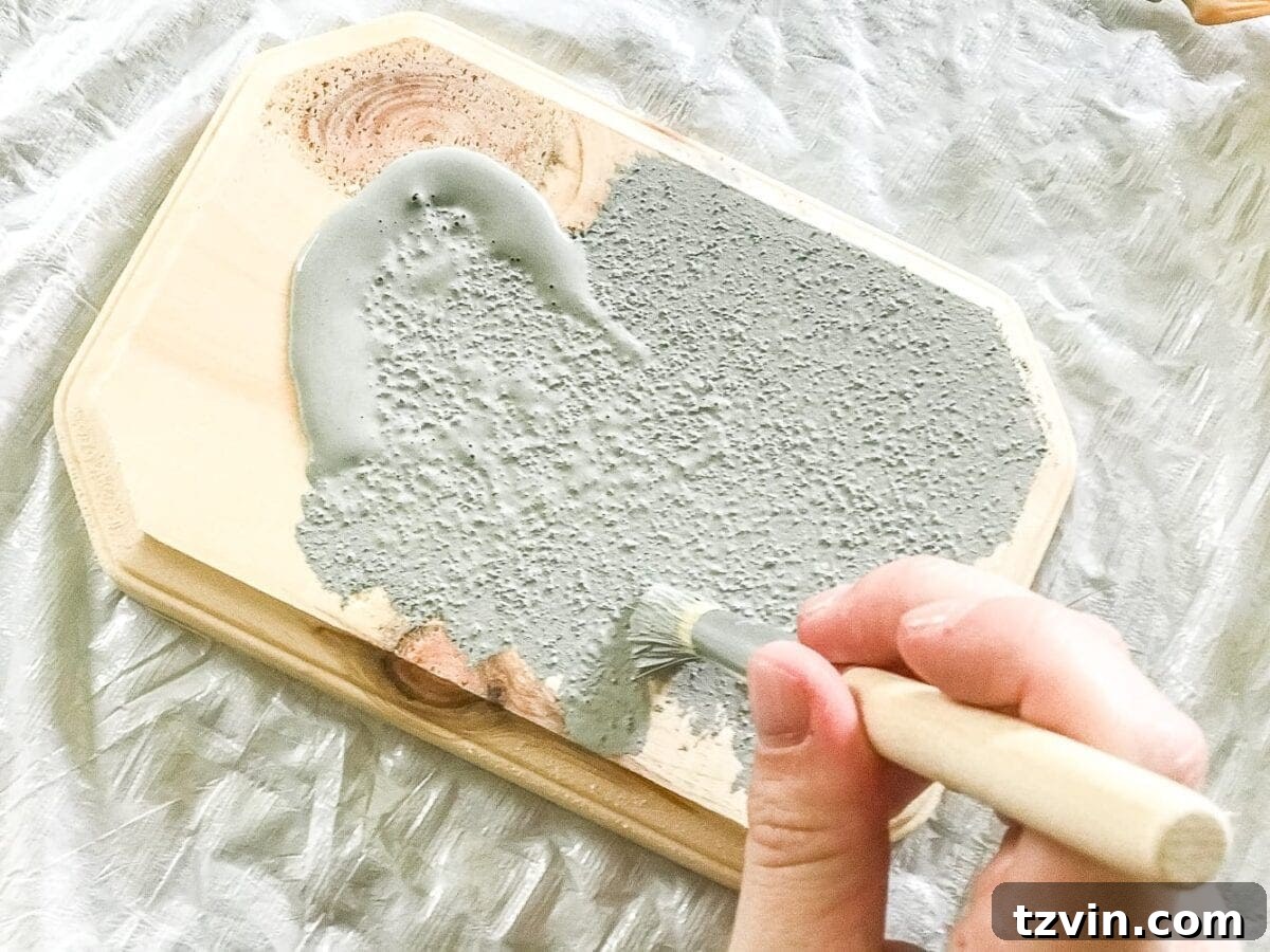 Homemade Concrete Horse Statue 4 Painting the horse and plaque with light gray paint