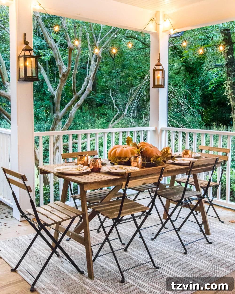 Fall Porch Perfection: Crafting Your Cozy Outdoor Oasis 17 cozy fall porch dining with lanterns and string lights