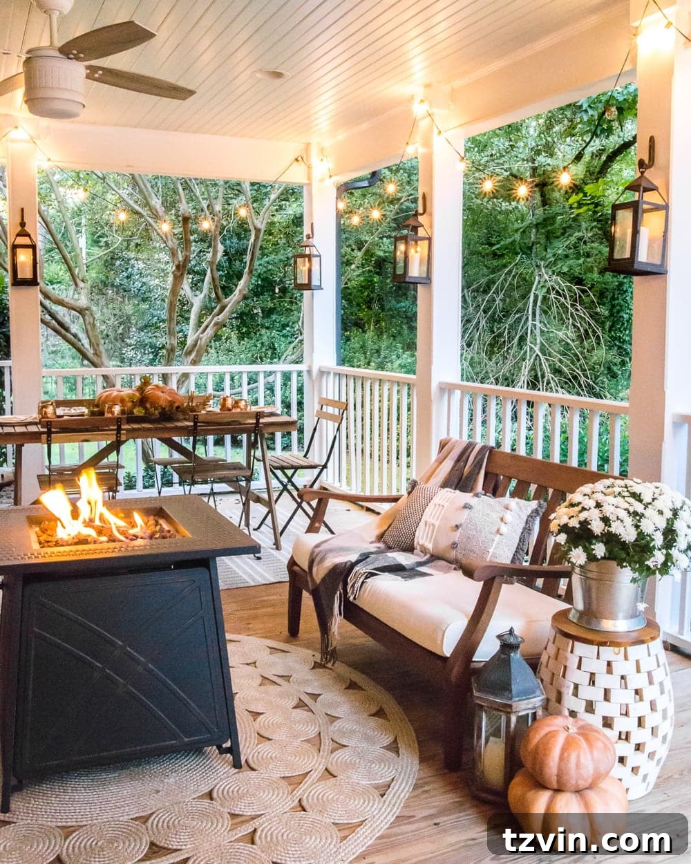 Fall Porch Perfection: Crafting Your Cozy Outdoor Oasis 18 cozy fall porch with fire pit, string lights, and lanterns