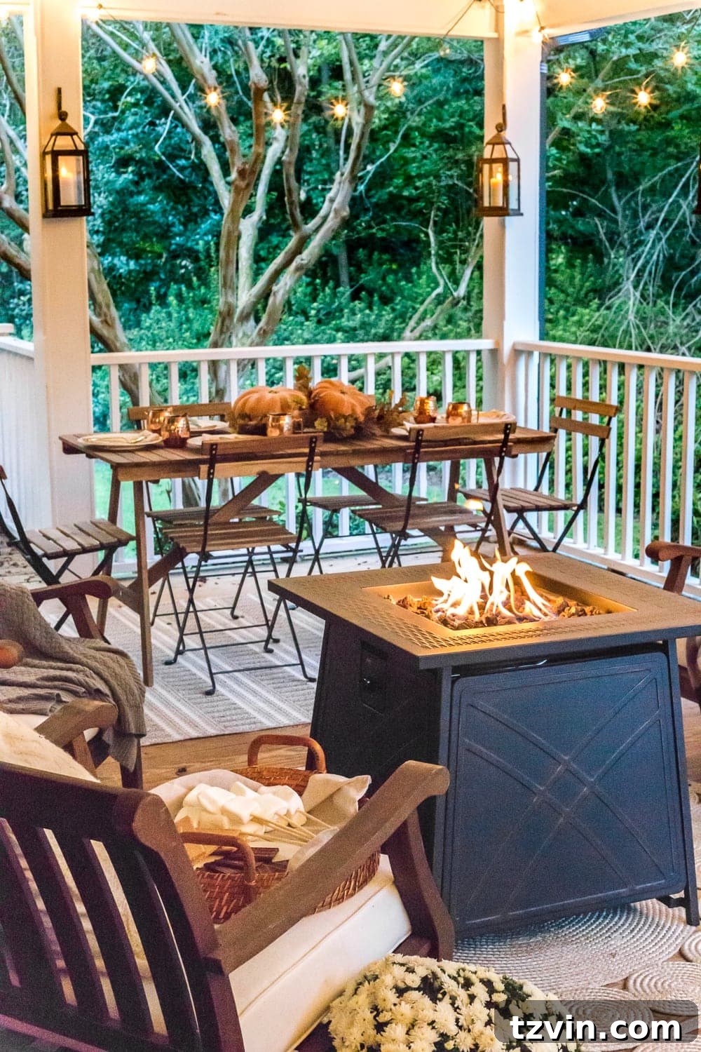 Fall Porch Perfection: Crafting Your Cozy Outdoor Oasis 20 cozy fall porch with fire pit, string lights, and lanterns