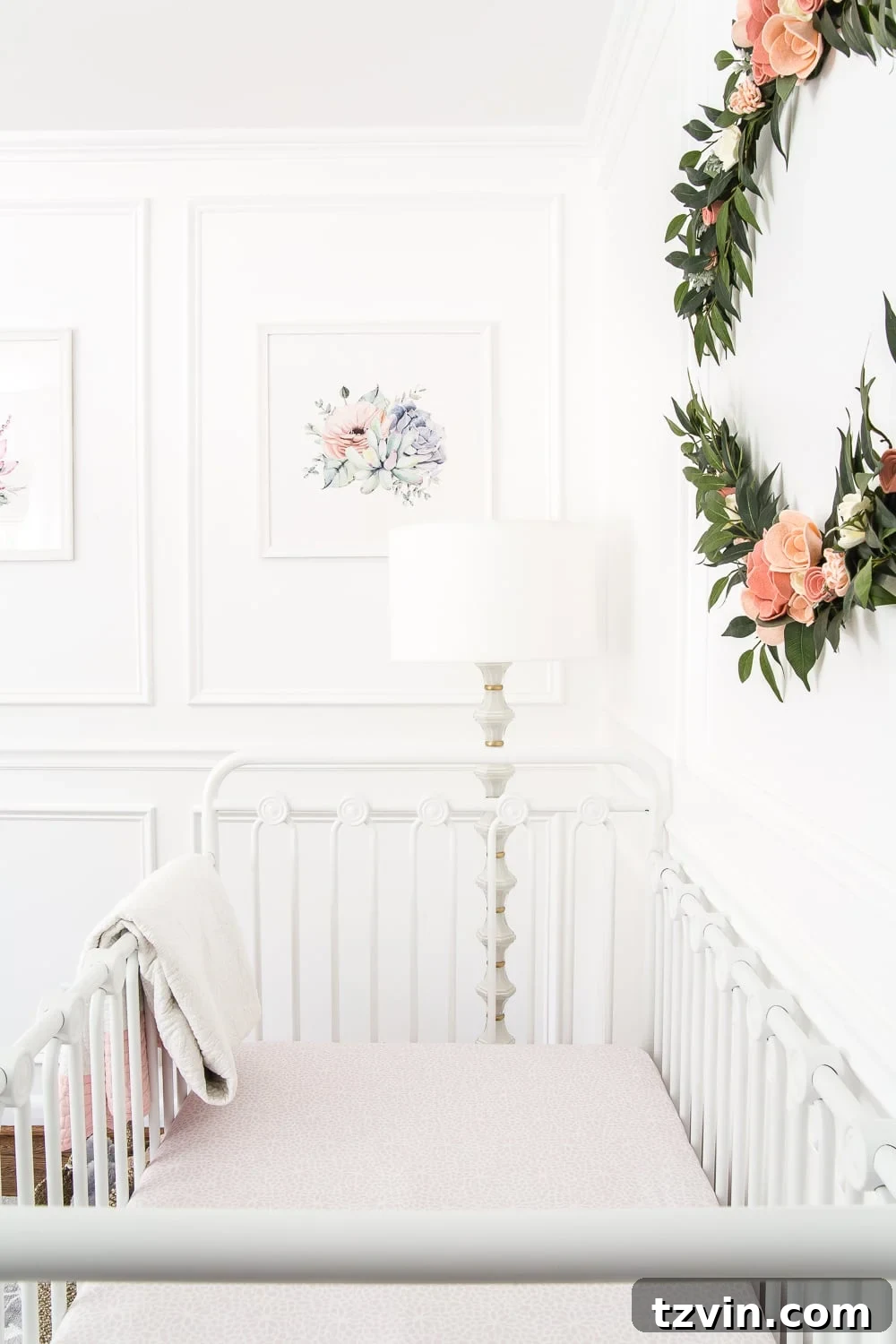 Blossoming Dreams: White Floral Nursery Reveal 14 Wall art and closet doors in the white nursery.