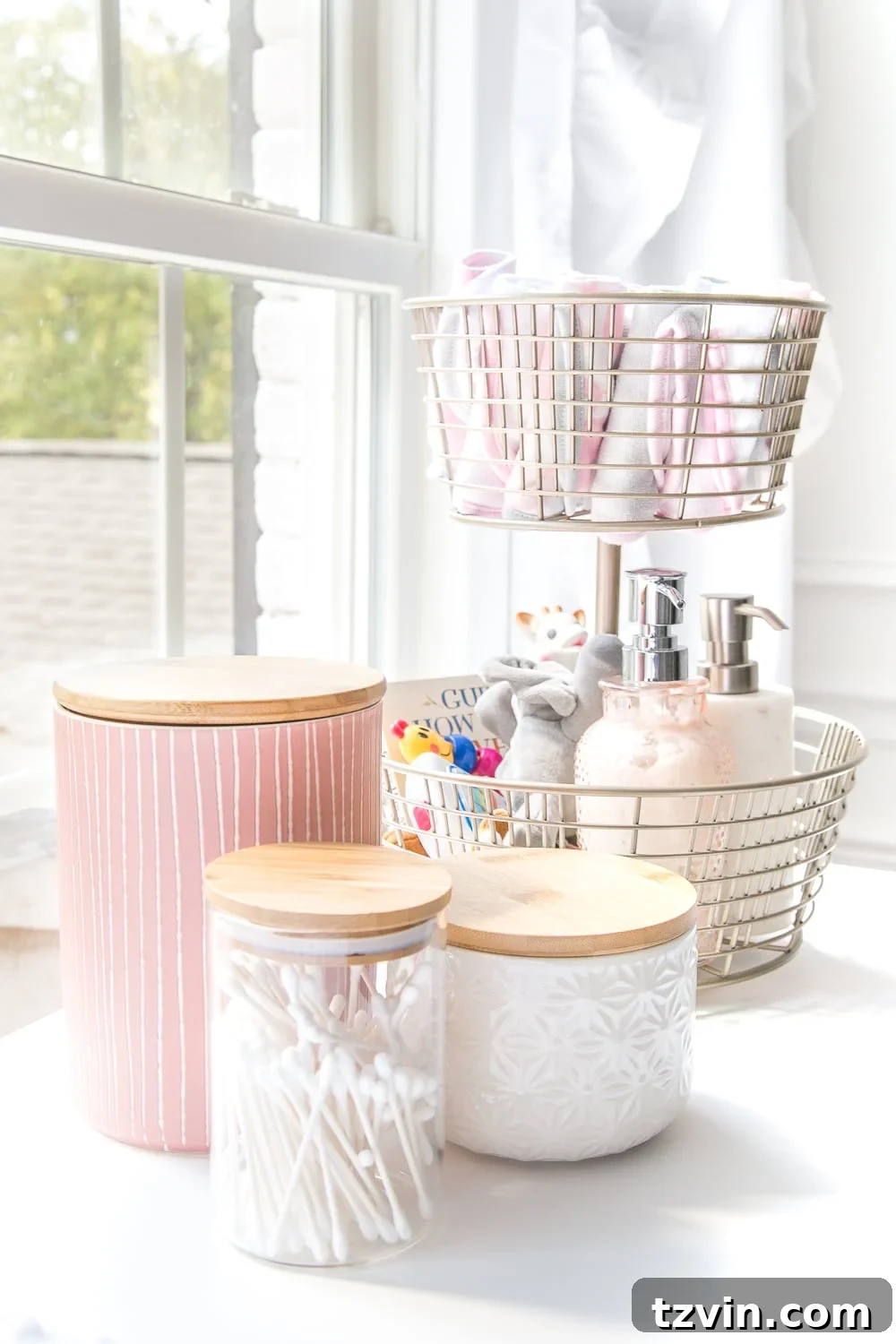 Blossoming Dreams: White Floral Nursery Reveal 21 Tiered basket with changing essentials in the white nursery.