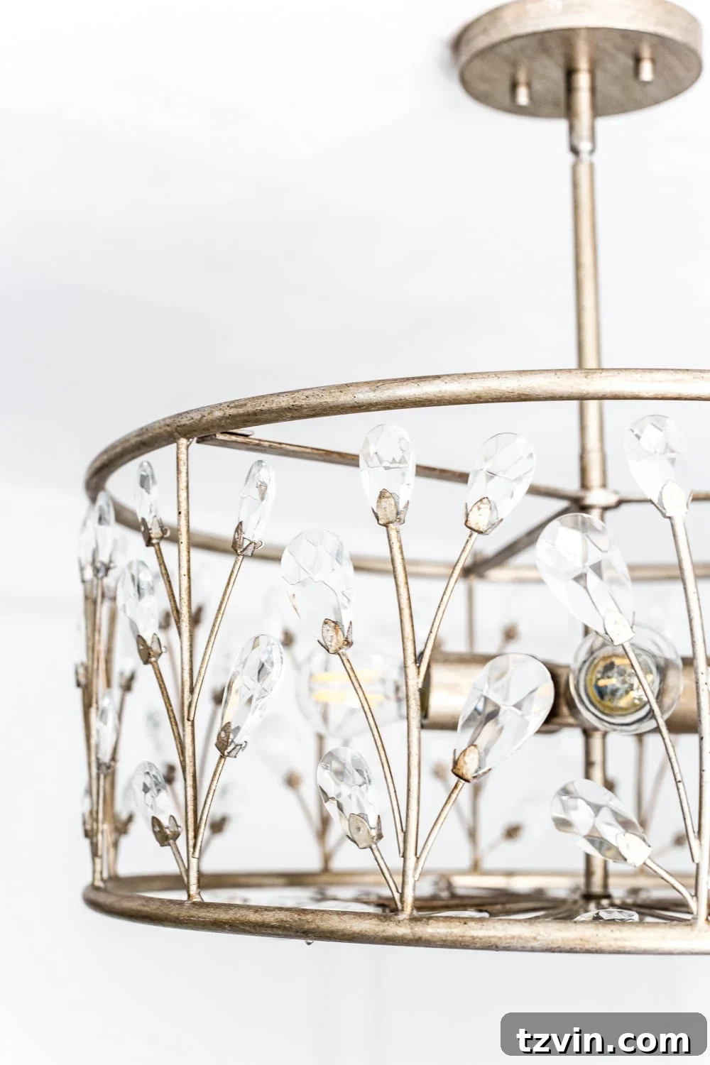 Blossoming Dreams: White Floral Nursery Reveal 24 Close-up of gold accents and floral details in the white nursery.