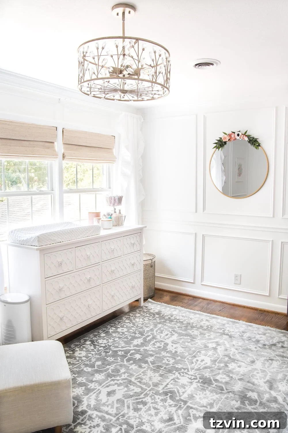 Blossoming Dreams: White Floral Nursery Reveal 7 Close-up of the elegant pendant light fixture in the white nursery.