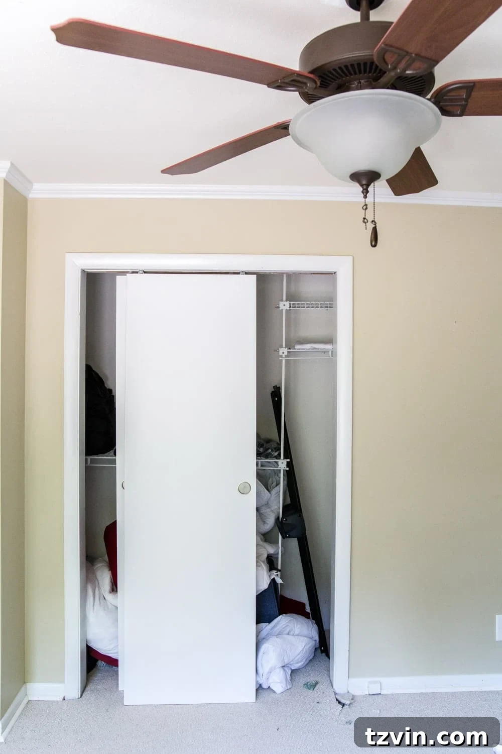 Blossoming Dreams: White Floral Nursery Reveal 8 Before photo of the nursery closet doors.