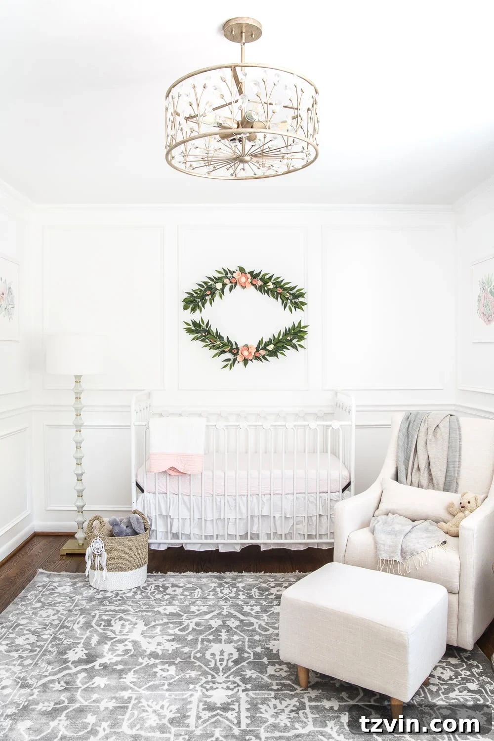 Blossoming Dreams: White Floral Nursery Reveal 10 Cozy white nursery with a crib, glider, and a gray and white area rug.