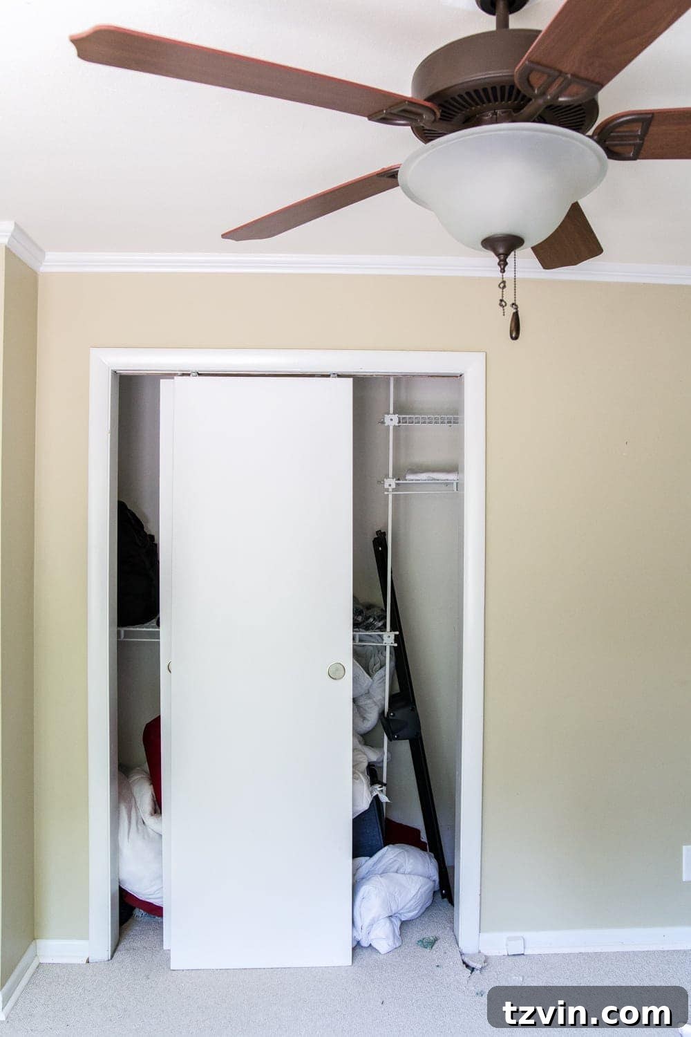Nursery Closet Makeover | before - cluttered wire shelving
