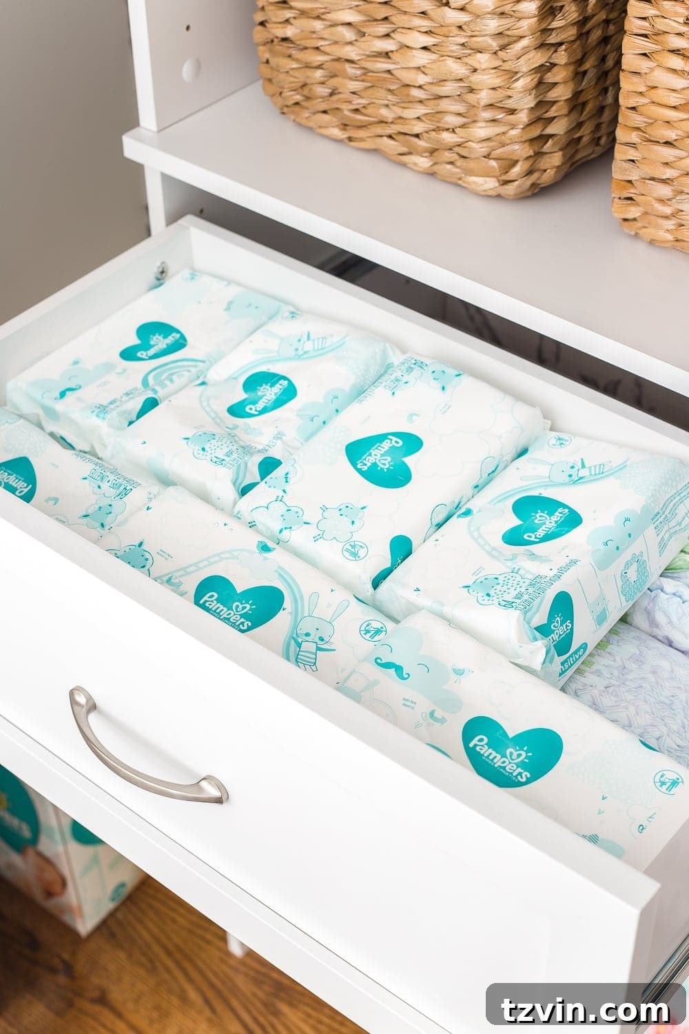 Nursery closet organization with built-in drawers for efficient diaper storage