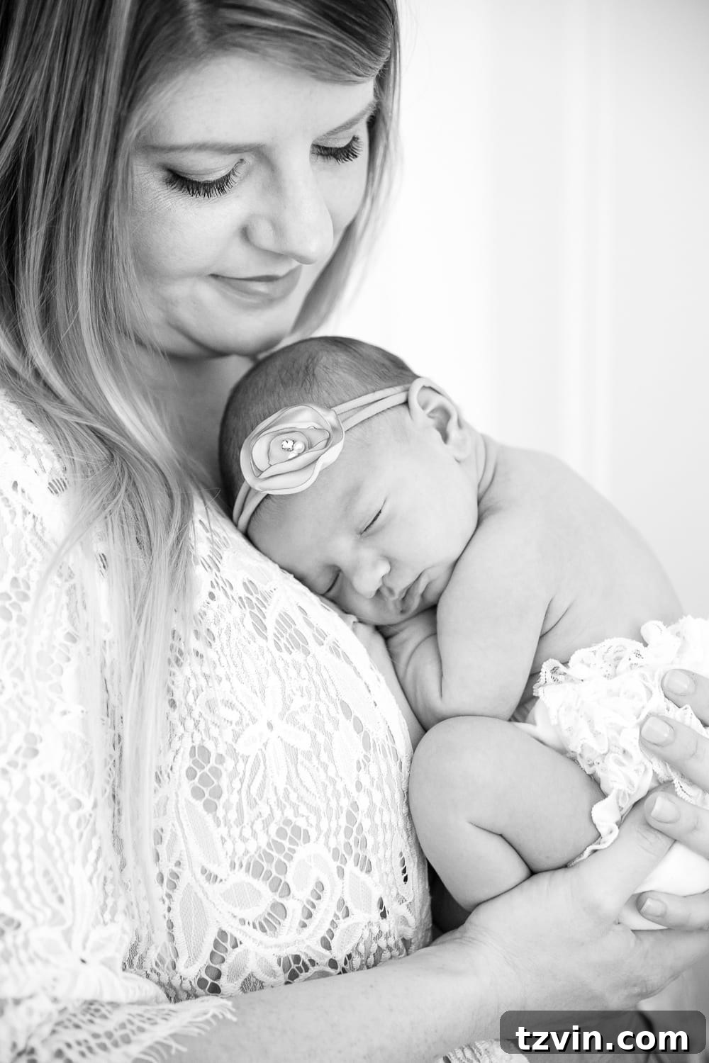 The mother holding her newborn