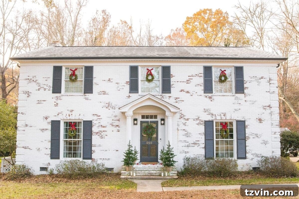 Colonial Charm Outdoor Christmas Wreaths 3 Our limewashed house exterior beautifully decorated for Christmas with wreaths and festive touches.