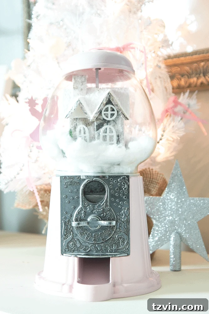 Handmade Holiday Magic: Affordable Christmas Decor for 2024 19 Repurposed snow globe created from a thrifted gumball machine, a whimsical and inexpensive Christmas decoration.