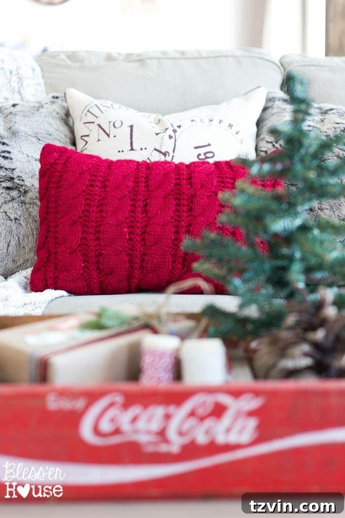 Handmade Holiday Magic: Affordable Christmas Decor for 2024 25 An old sweater repurposed into a homemade pillow, offering cozy and inexpensive Christmas decor.
