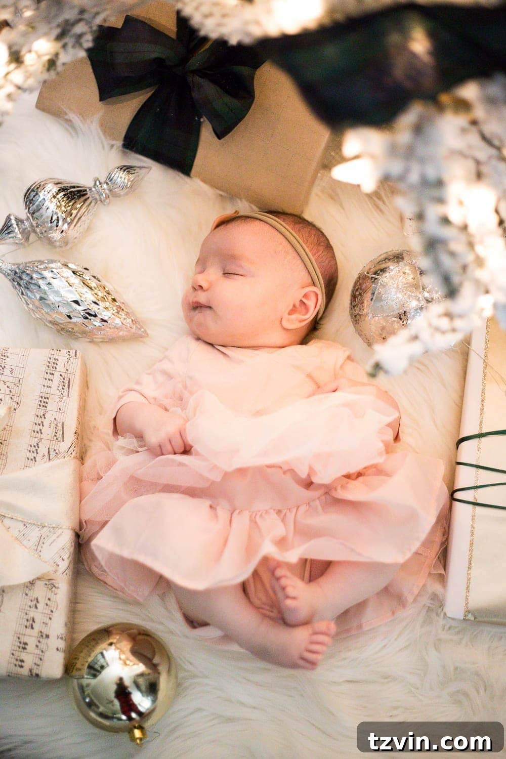 DIY Christmas Magic: Easy Family Photos at Home 12 Baby's First Christmas photoshoot under a tree, showcasing sharp focus and soft bokeh