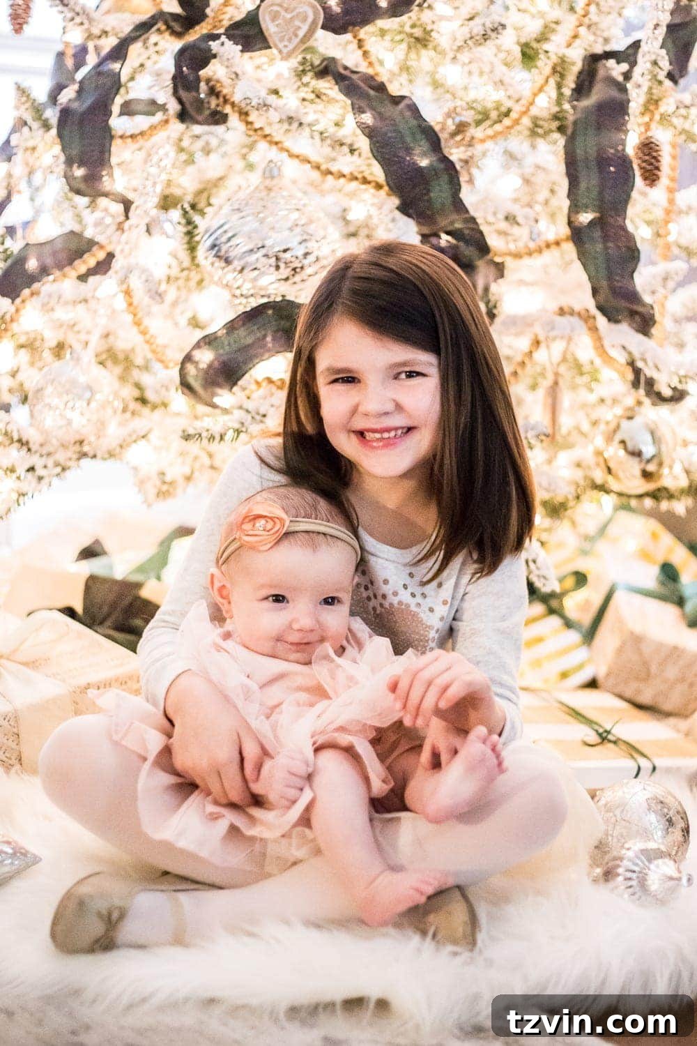 DIY Christmas Magic: Easy Family Photos at Home 13 Family Christmas photos in front of a tree, demonstrating proper focus on subjects