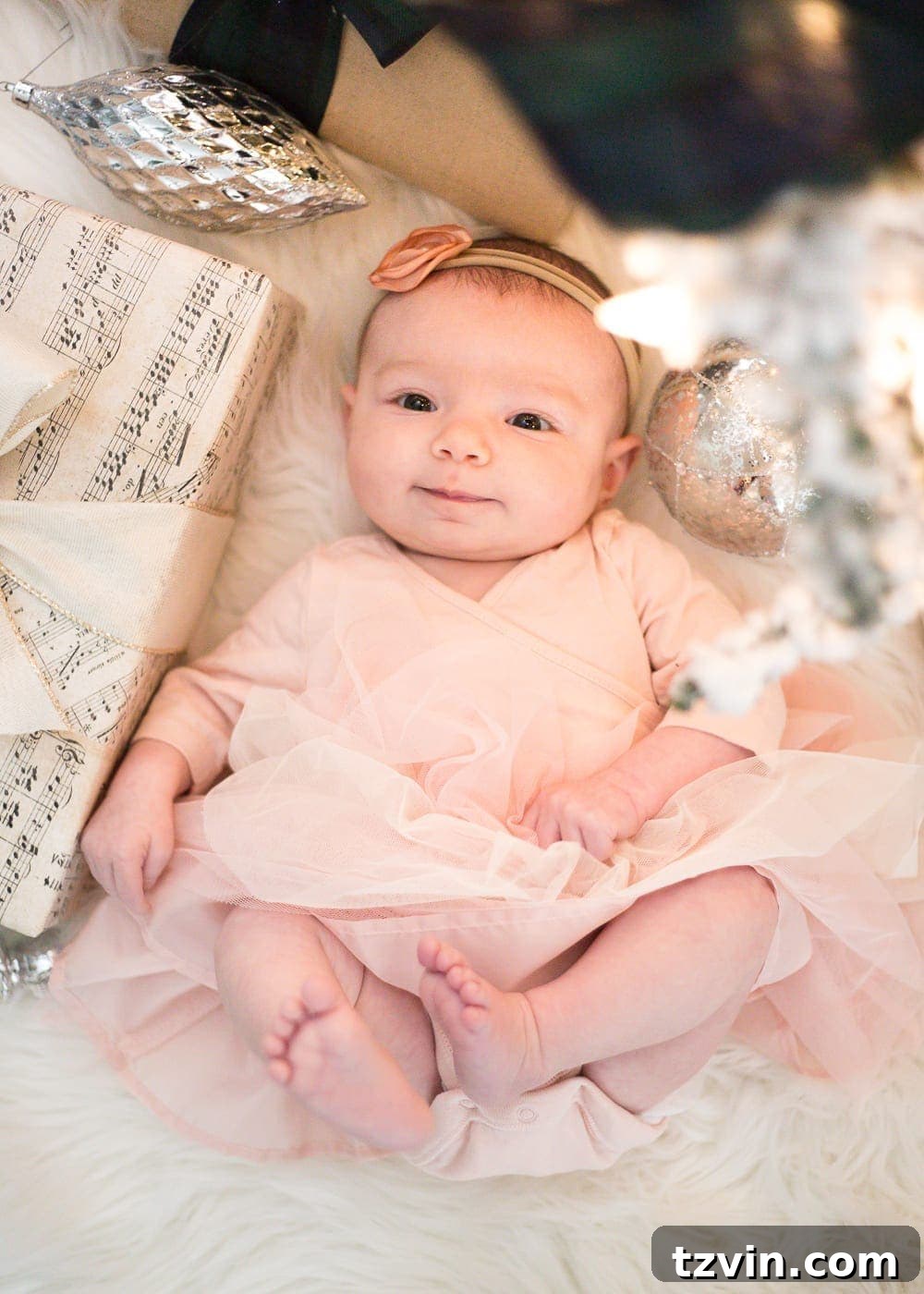 DIY Christmas Magic: Easy Family Photos at Home 10 Framing family photos beside a Christmas tree for a heartwarming holiday portrait