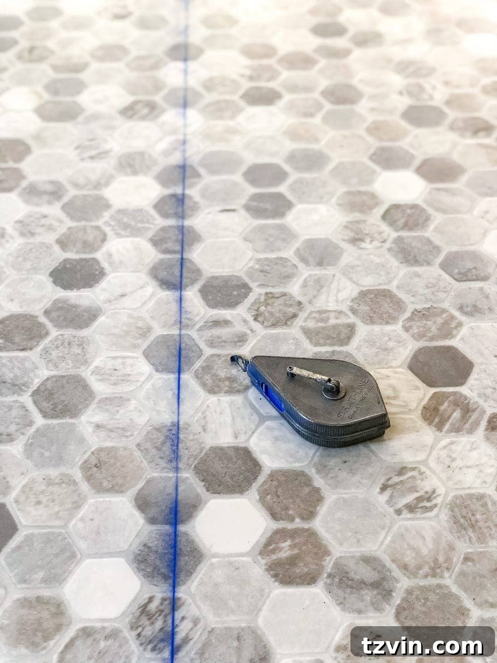 Install Sheet Vinyl Flooring Over Tile The Easy DIY Way 14 Marking straight lines on sheet vinyl flooring using a chalk line