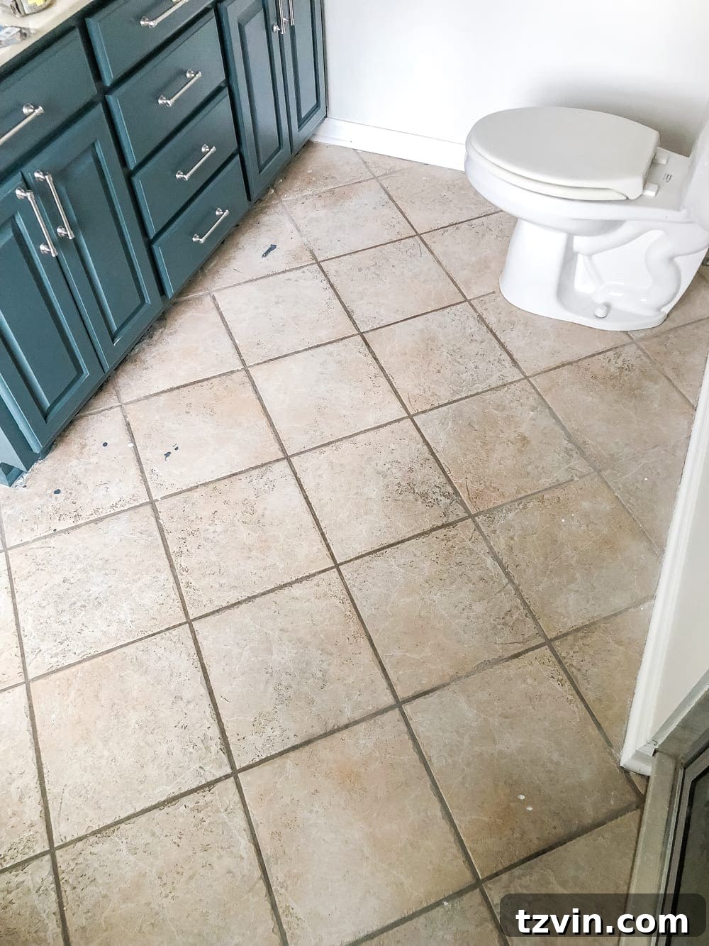 Install Sheet Vinyl Flooring Over Tile The Easy DIY Way 4 Close-up of old ceramic tile floor showing wear and discoloration
