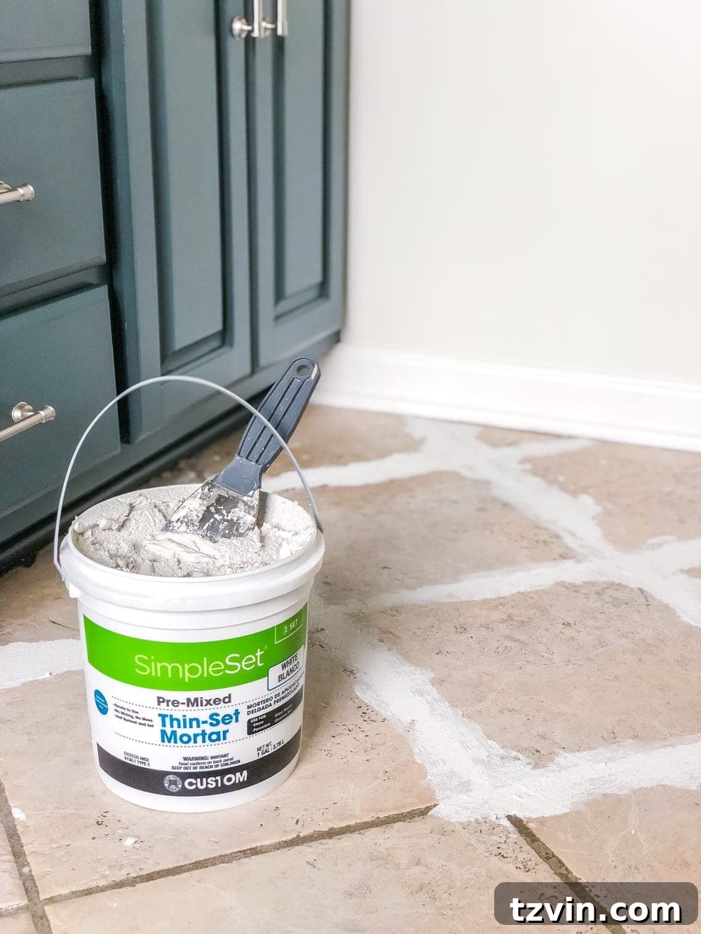 Install Sheet Vinyl Flooring Over Tile The Easy DIY Way 6 Filling grout lines of ceramic tile with thin-set mortar for smooth subfloor