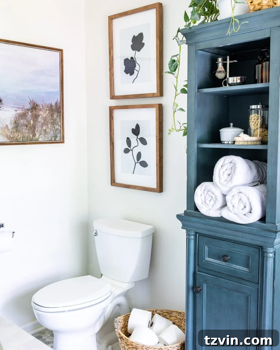 Luxury Lavatory Looks for Less 5 DIY silhouette leaf bathroom art using spray paint and faux leaves creates a minimalist, natural aesthetic
