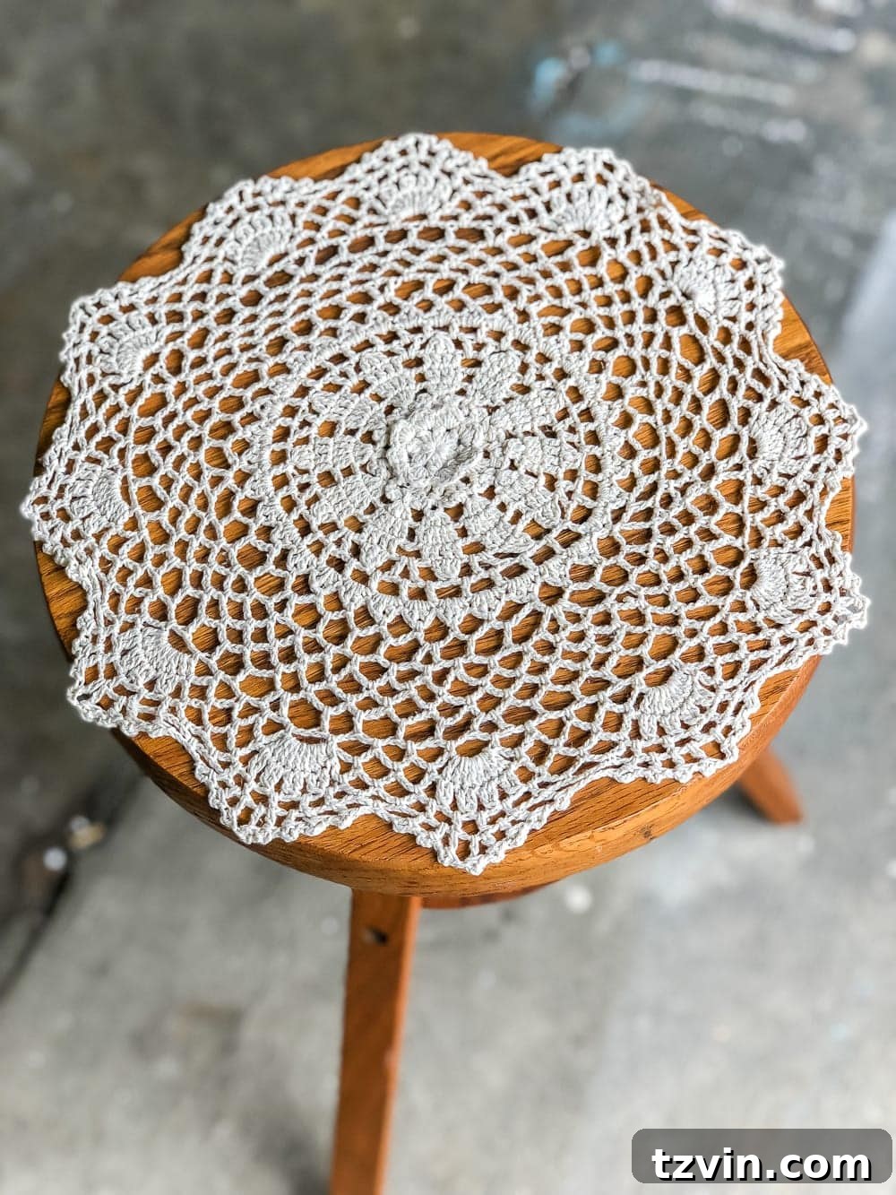 From Keys to Green: Piano Stool Plant Perch 3 A global designer-inspired DIY plant stand made from a thrifted piano stool using just spray paint and a doily for a quick and easy makeover. #plantstand #pianostool #globaldecor #spraypaint #thrifting #diyhomedecor #thriftedhomedecor