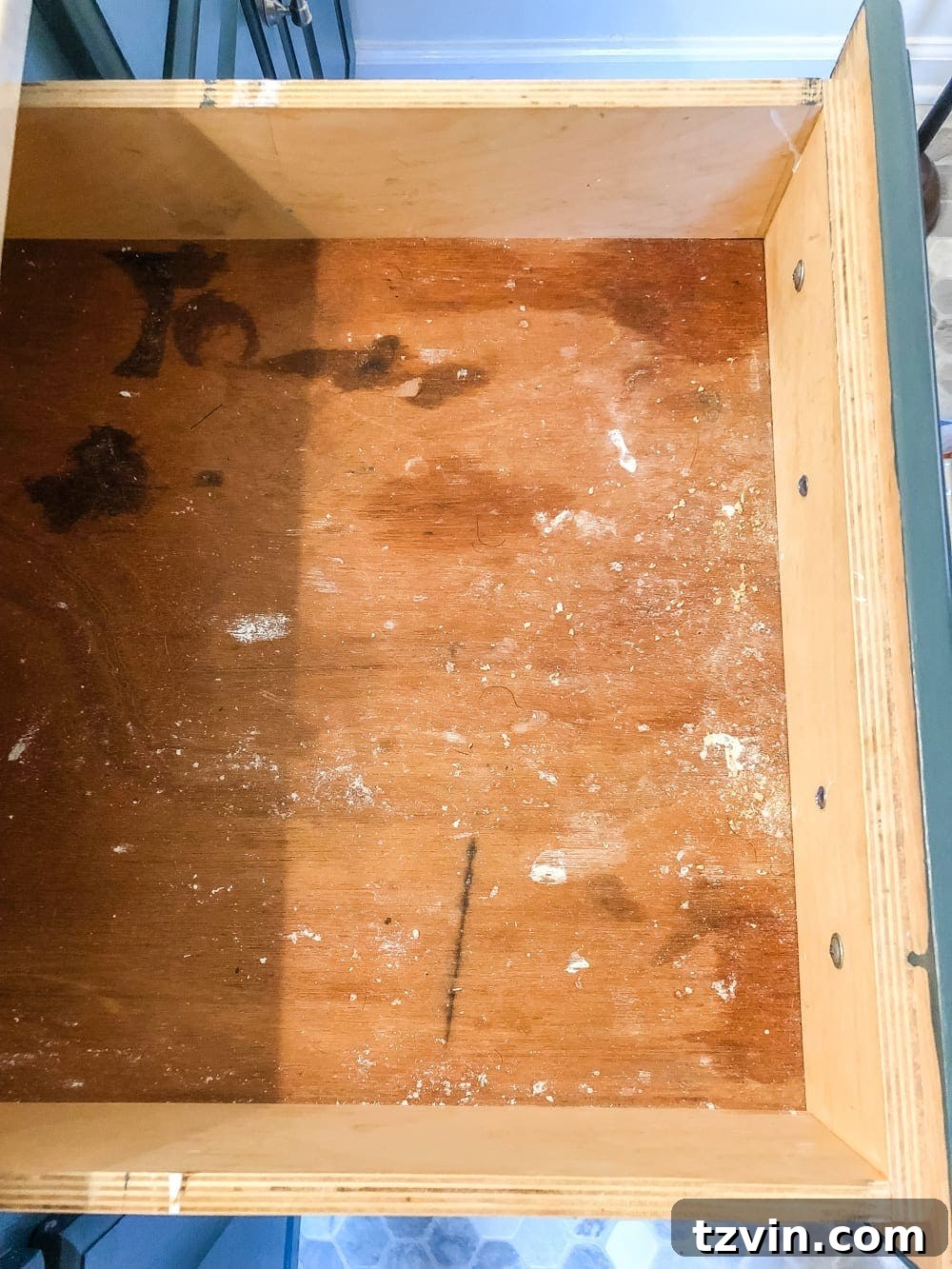 Bathroom vanity countertop covered with sorted piles of beauty and hygiene products, ready for organization. #DeclutteringProcess #BathroomMakeover #OrganizeYourLife