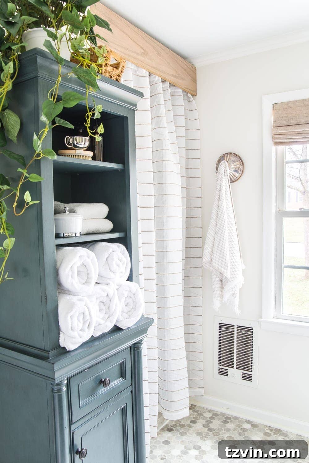 Master Bathroom Makeover: Stunning Results On A Budget 13 Detailed view of DIY wooden cornice and semi-sheer curtain covering shower door